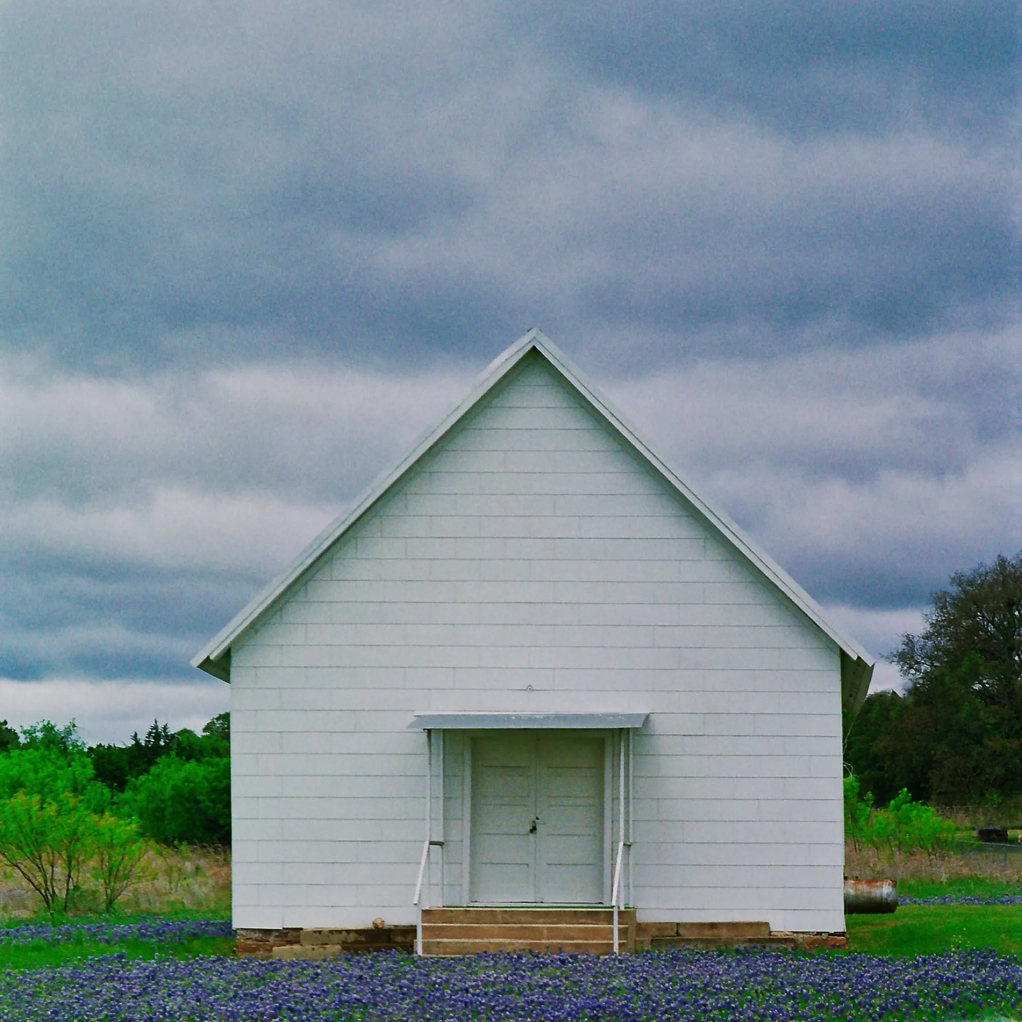 Simple church in a field of bluebonnets in Texas