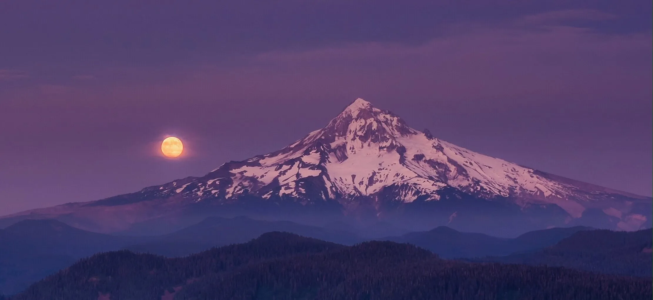 Mt Hood with a harvest moon next to it.
