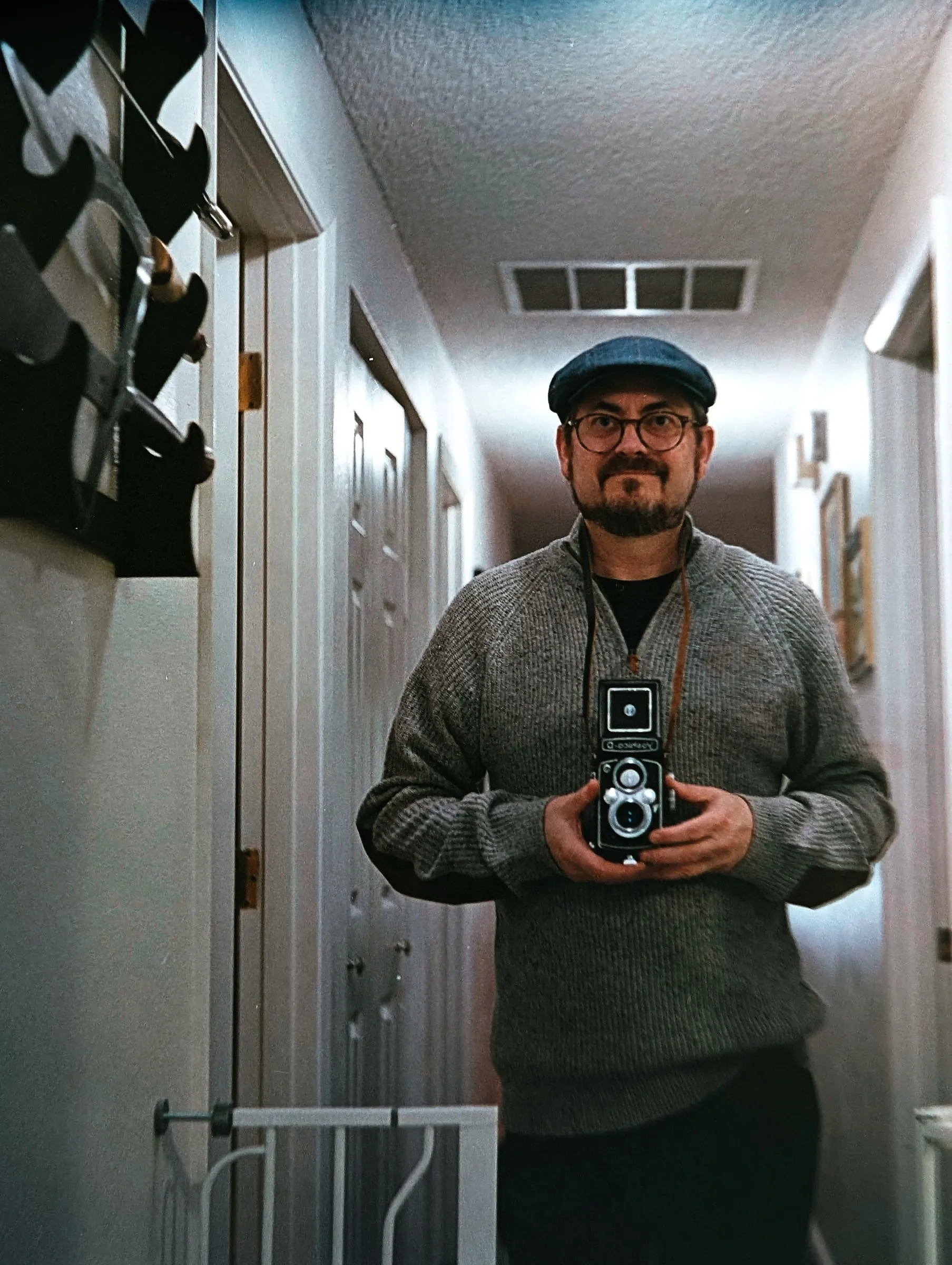 Chris taking a selfie with an old film camera