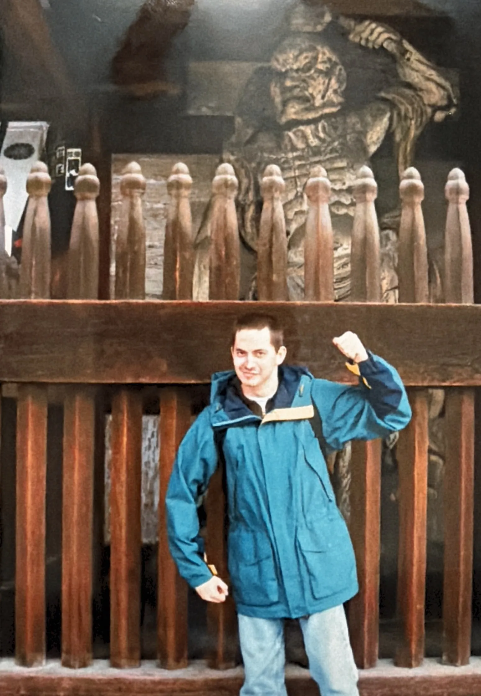Chris posing in front of an ancient statue