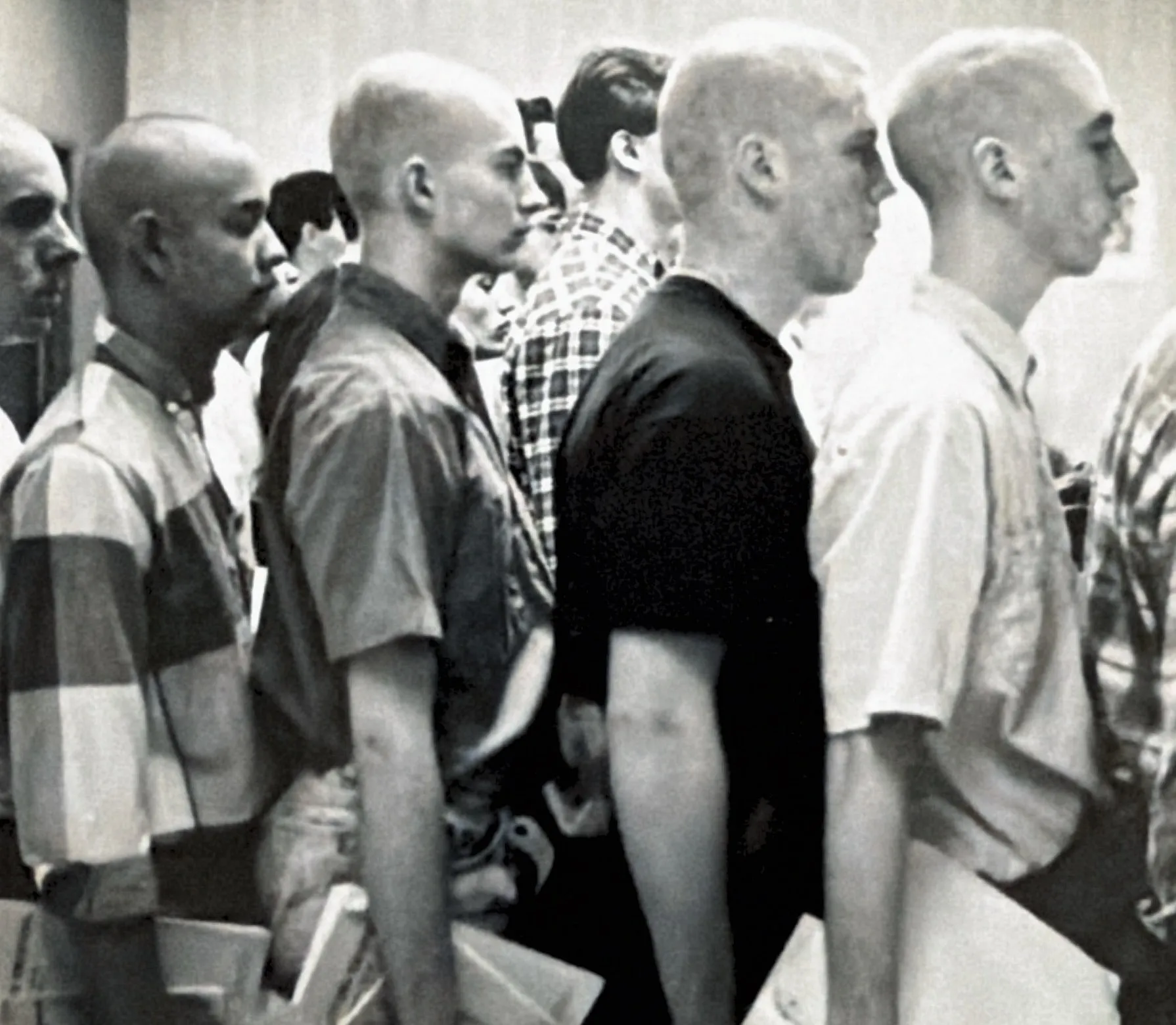 Chris in line with no hair in basic training