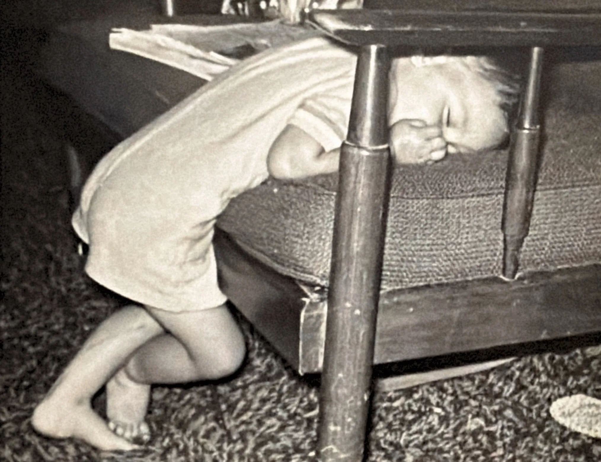 Chris sleeping head first on a chair